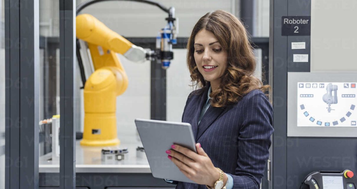 Businesswoman, working in high tech company, using digital tablet